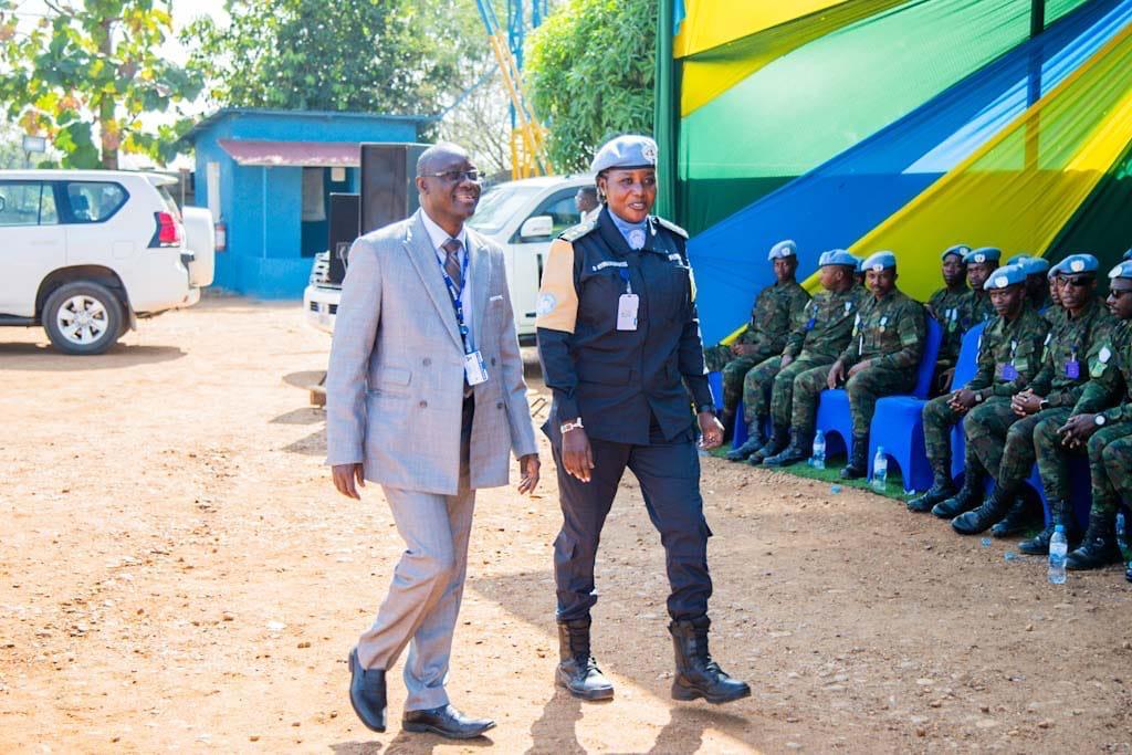Dr. Gassama arriving at the ceremony grounds accompanied by a senior Rwanda FPU officer